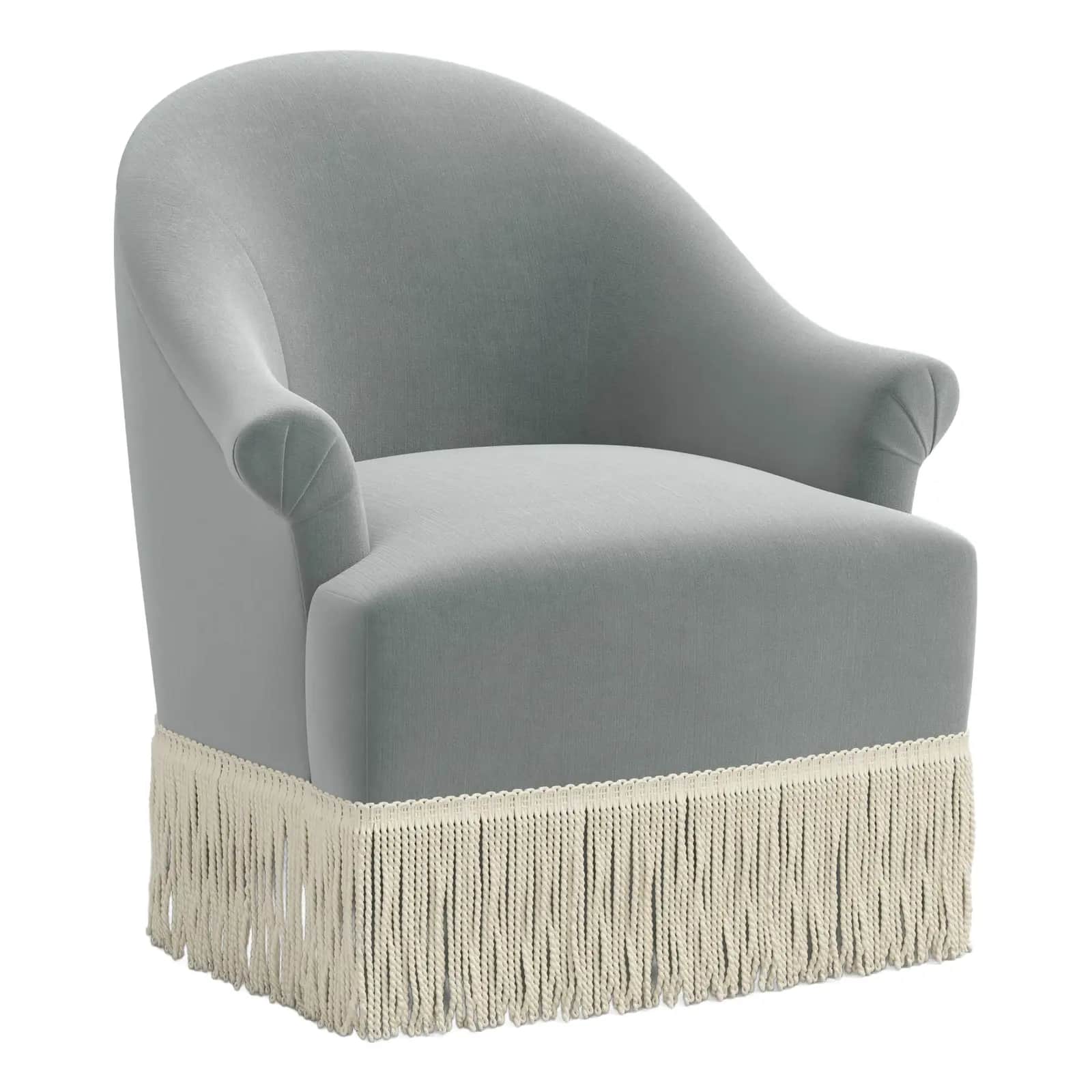 A upholstered armchair with a rounded back and arms, featuring a fringe trim along the bottom edge o… — 3D model