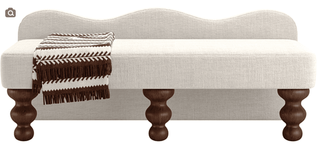 A contemporary upholstered bench featuring a distinct scalloped or wavy backrest. The bench is cover… — free STL 3D model