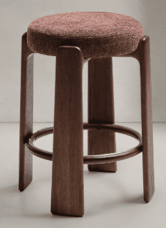 A wooden stool with a round, upholstered seat. The stool has four legs that are carved from wood and… — 3D model