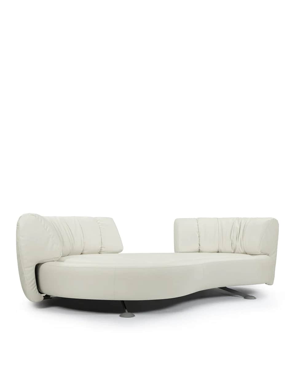 A contemporary, low-profile sofa with a curved, organic form. It features a generously padded seat a… — free OBJ 3D model