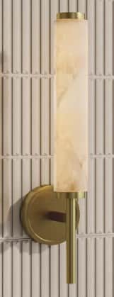 A modern wall sconce featuring a cylindrical alabaster shade mounted on a brushed brass fixture. The… — 3D model