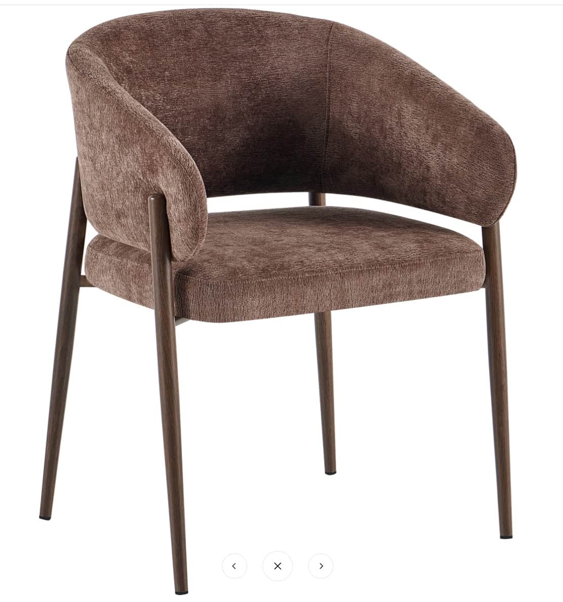 A modern accent chair with a curved backrest and upholstered seat and back. The chair features four… — 3D model