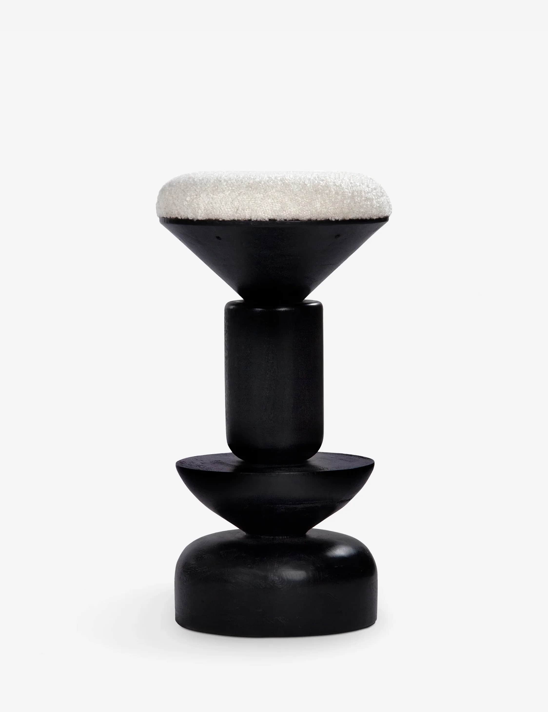 A striking sculptural stool featuring a matte black wooden base composed of stacked geometric shapes… — 3D model