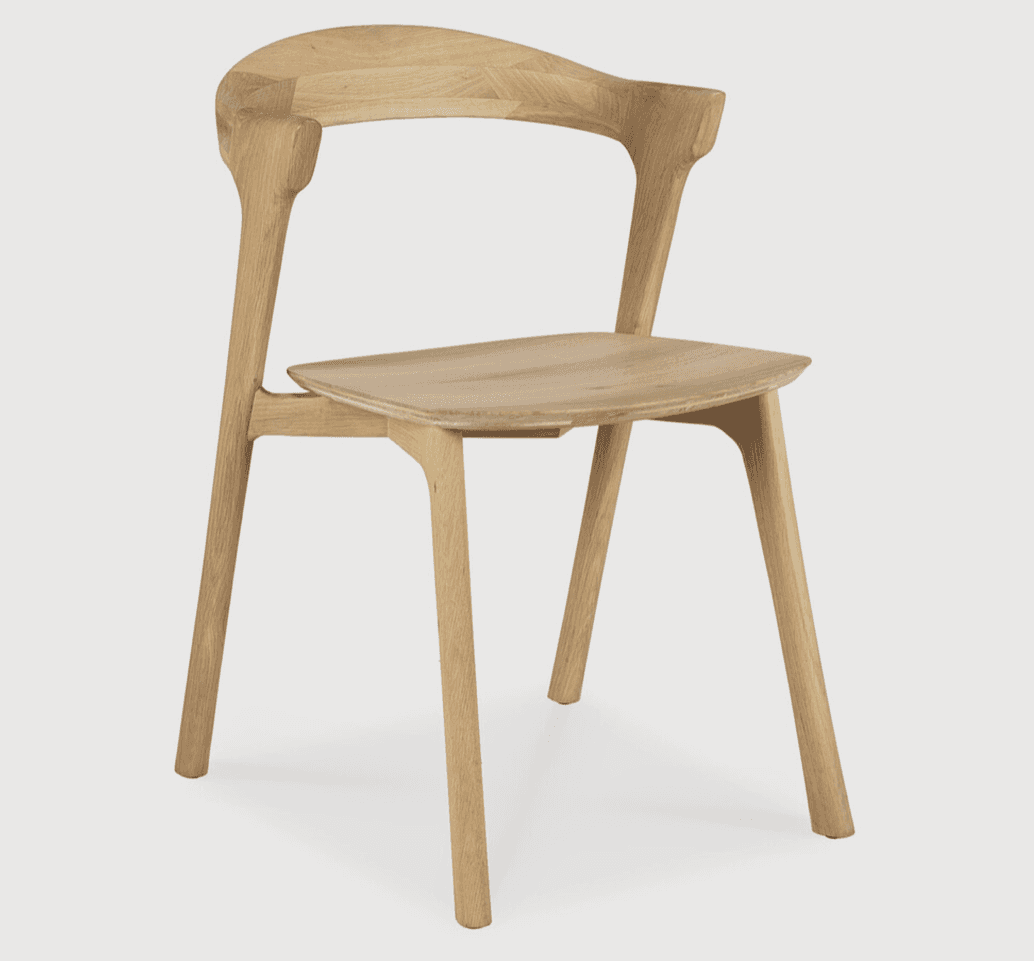 A modern armchair constructed from light-colored wood. It features a gently curved backrest that flo… — 3D model