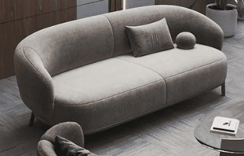 A modern, rounded loveseat with a soft, organic silhouette, upholstered in a light beige fabric. It… — 3D model