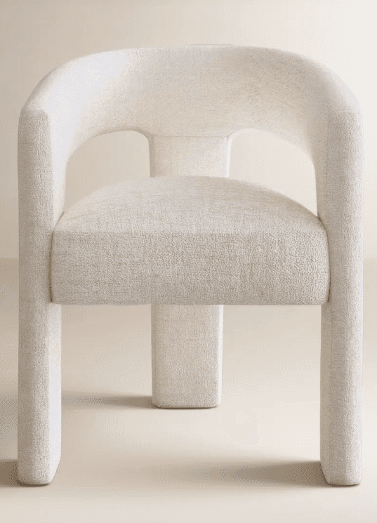 A contemporary fully upholstered armchair featuring a rounded backrest and integrated arms, covered… — 3D model