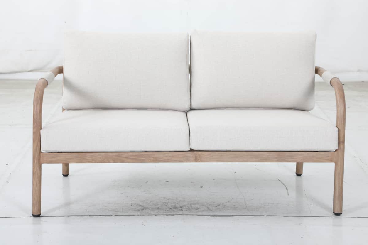 A two-seater sofa with a light-colored wooden frame and light-colored fabric upholstery. The frame f… — free GLTF 3D model