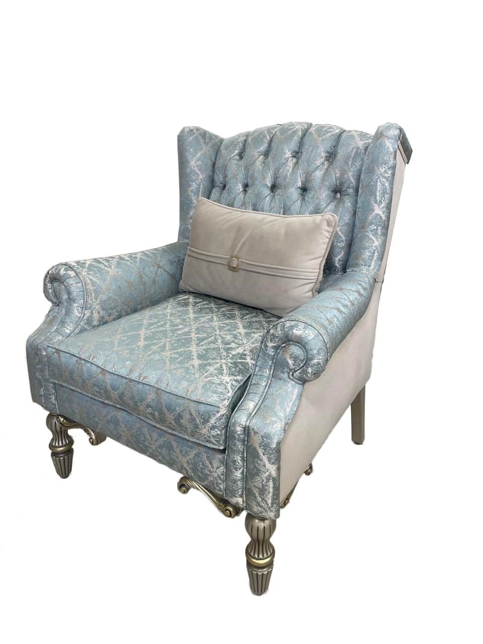 A tufted armchair with a high back and rolled arms, upholstered in a light blue fabric with a silver… — free OBJ 3D model