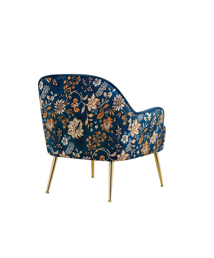 A single upholstered accent armchair featuring a deep blue fabric with an elaborate multi-color flor… — 3D model
