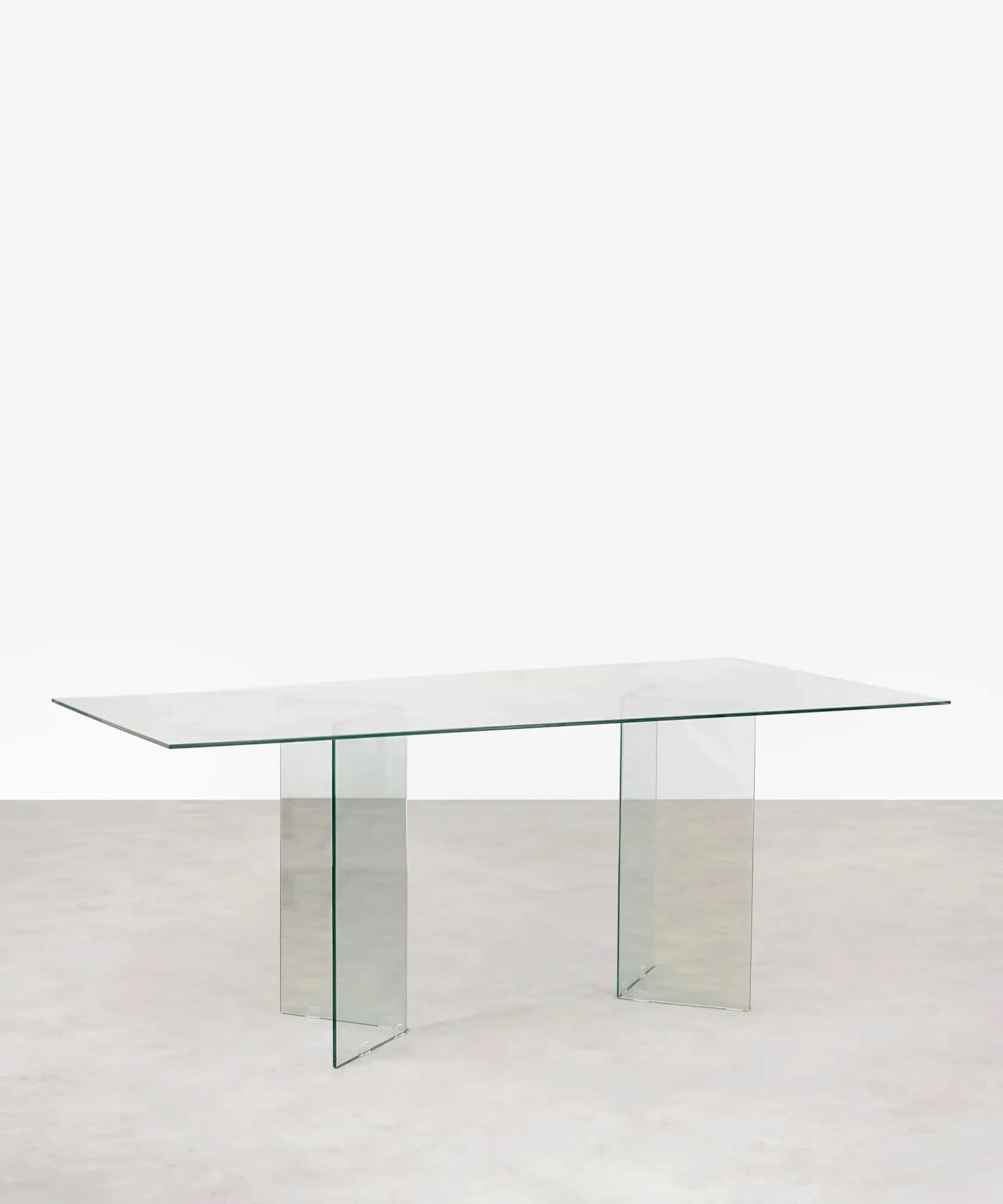A rectangular table constructed entirely from clear glass, featuring a flat top supported by two dis… — 3D model