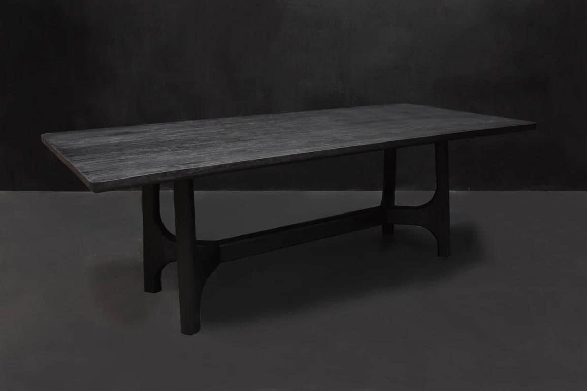 A rectangular dining table crafted from dark-stained wood, featuring a subtly textured tabletop and… — 3D model