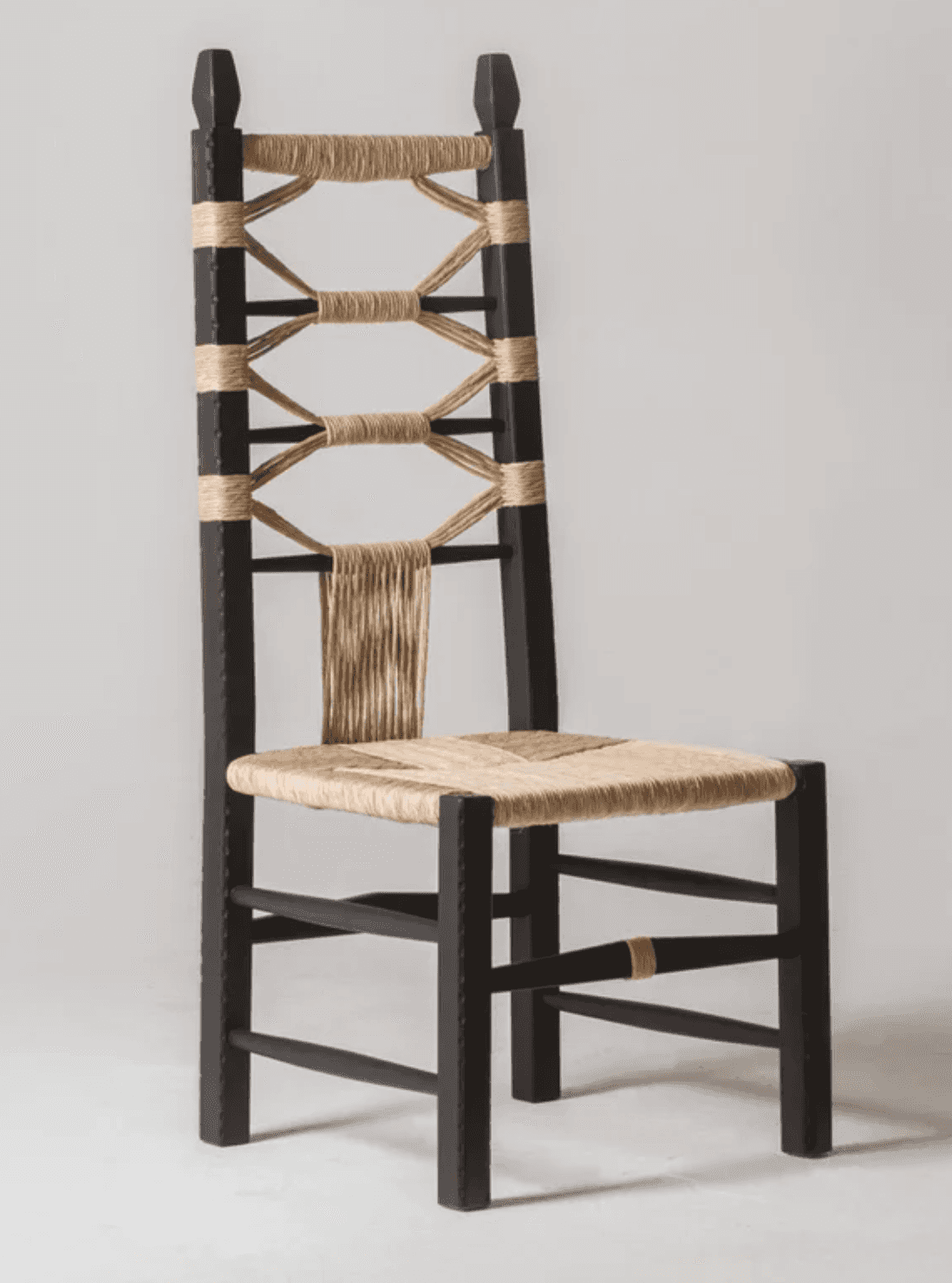A dark-stained wooden chair with a high back, featuring a seat and backrest woven from natural fiber… — free FBX 3D model