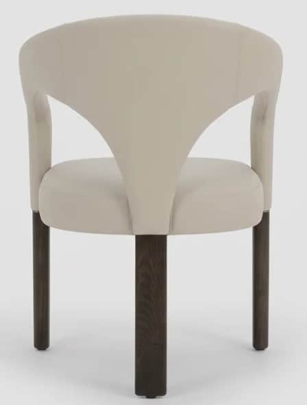 A contemporary armchair featuring a distinctive curved, upholstered backrest that flows seamlessly i… — 3D model