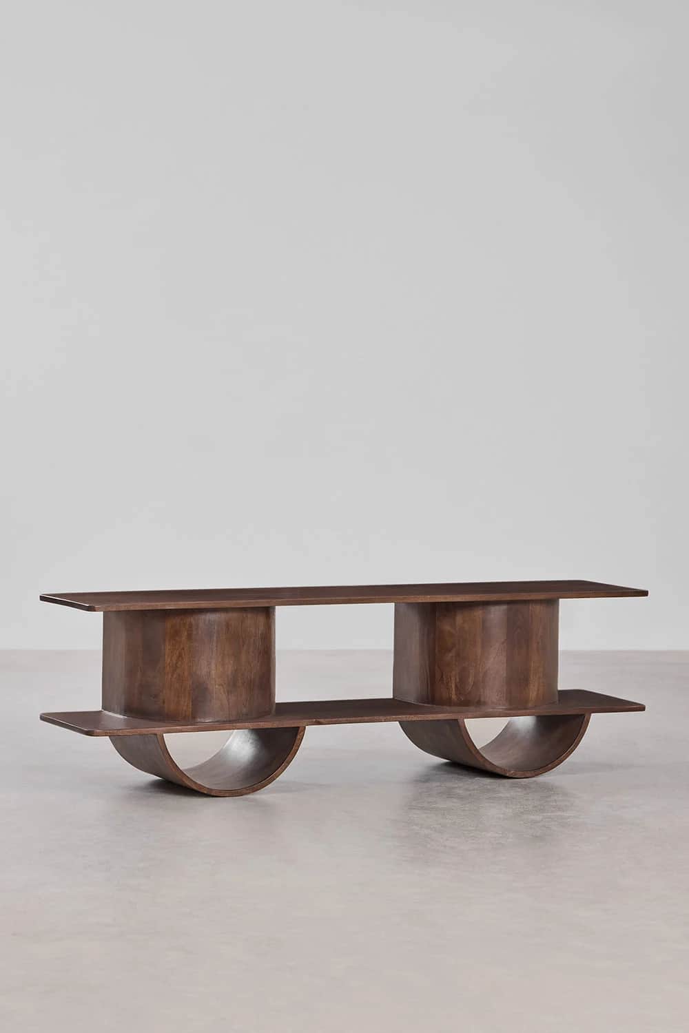 A contemporary coffee table with a distinct sculptural form. It features a rectangular top supported… — free BLEND 3D model