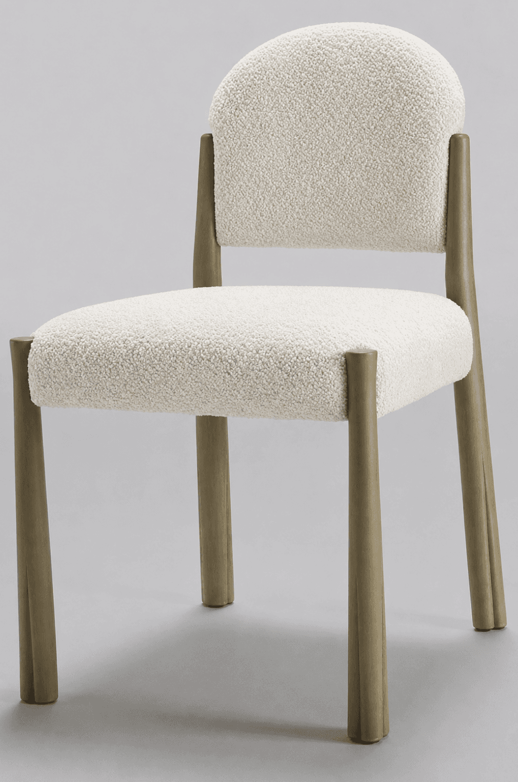 A contemporary dining chair featuring a rounded, padded backrest and seat, both upholstered in off-w… — 3D model