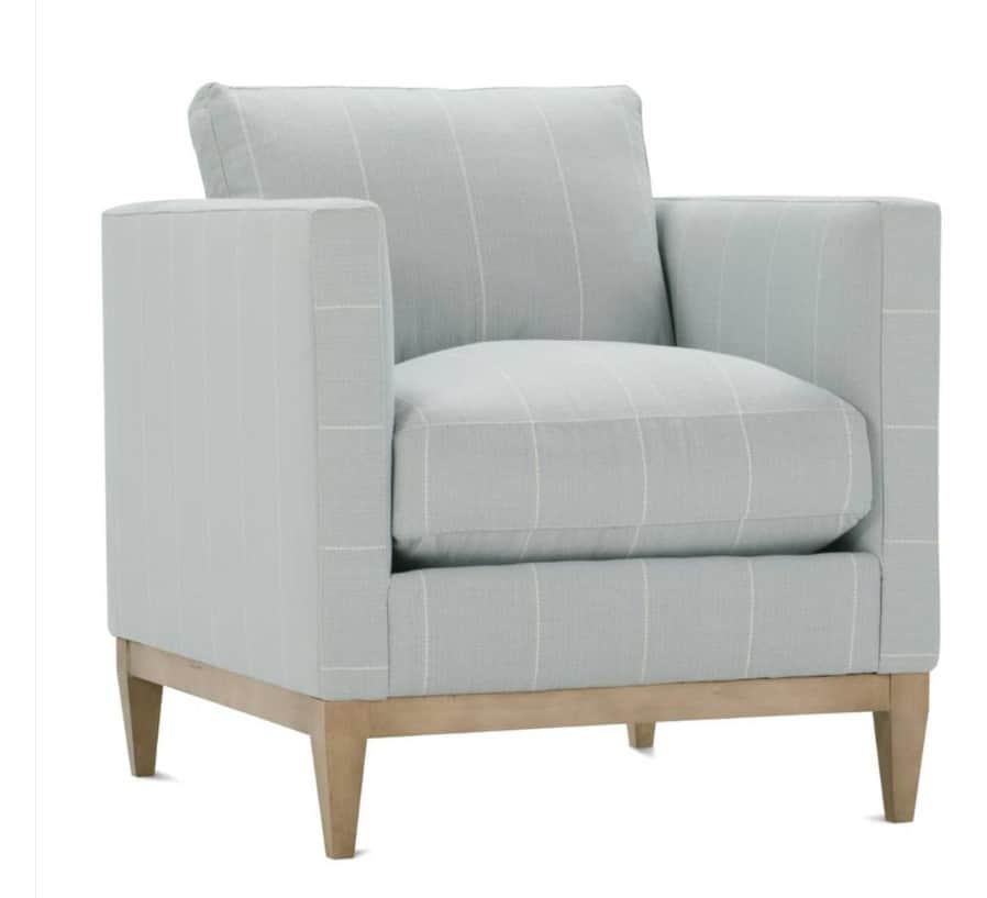 A single upholstered armchair with a clean, contemporary design. The chair features a padded seat an… — 3D model