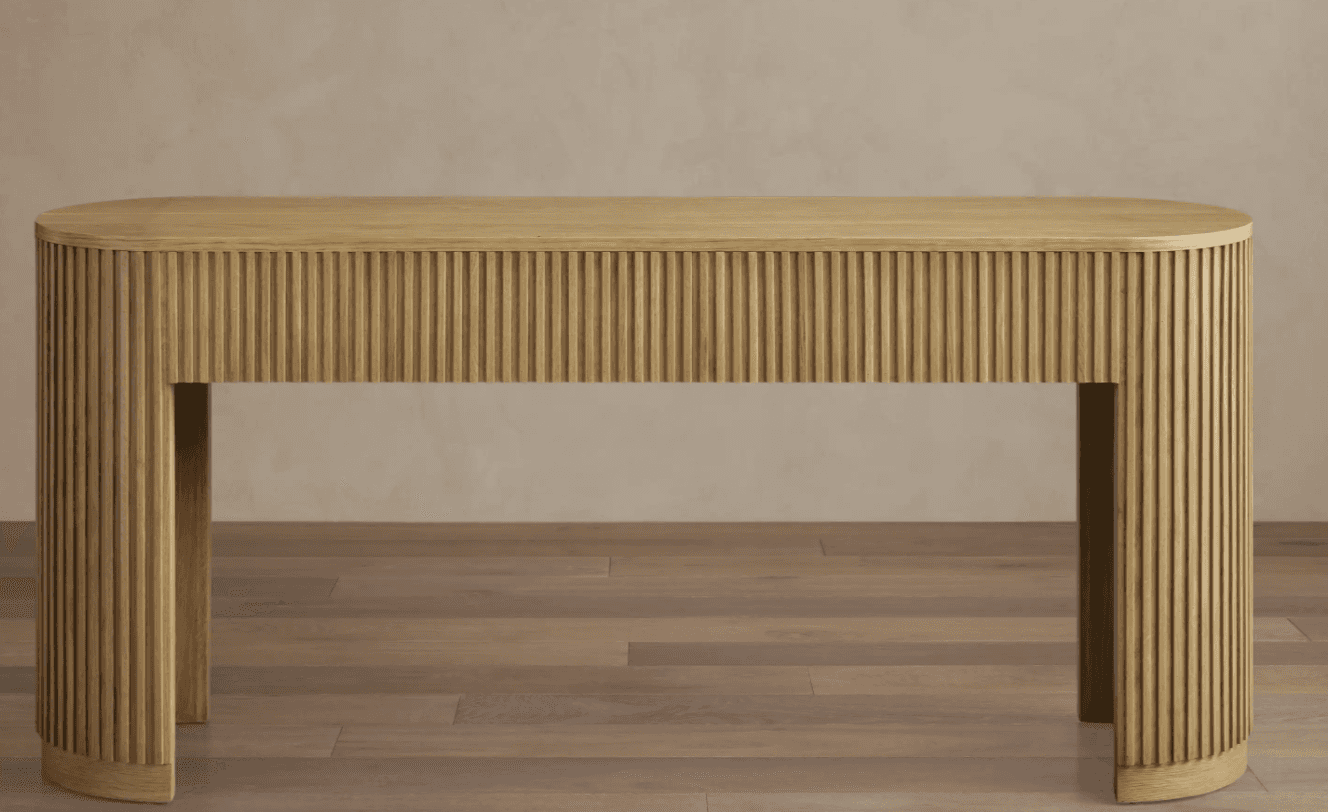 A narrow console table with a fluted design on its sides and front. It features a rounded rectangula… — free OBJ 3D model