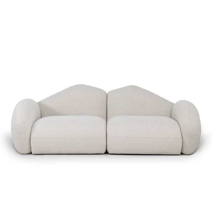 A two-piece modular sofa upholstered in off-white boucle fabric, featuring a contemporary design wit… — 3D model