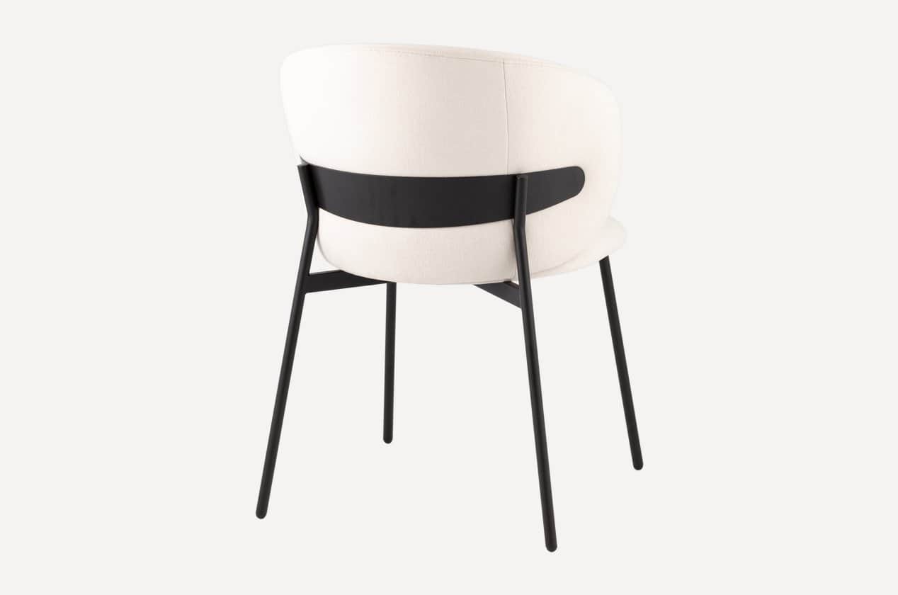 A modern accent chair with a curved backrest upholstered in a textured off-white fabric. The chair f… — 3D model