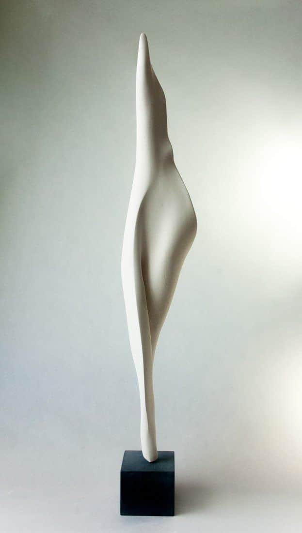 An elegant abstract table sculpture featuring a tall, off-white biomorphic form reminiscent of a cal… — 3D model