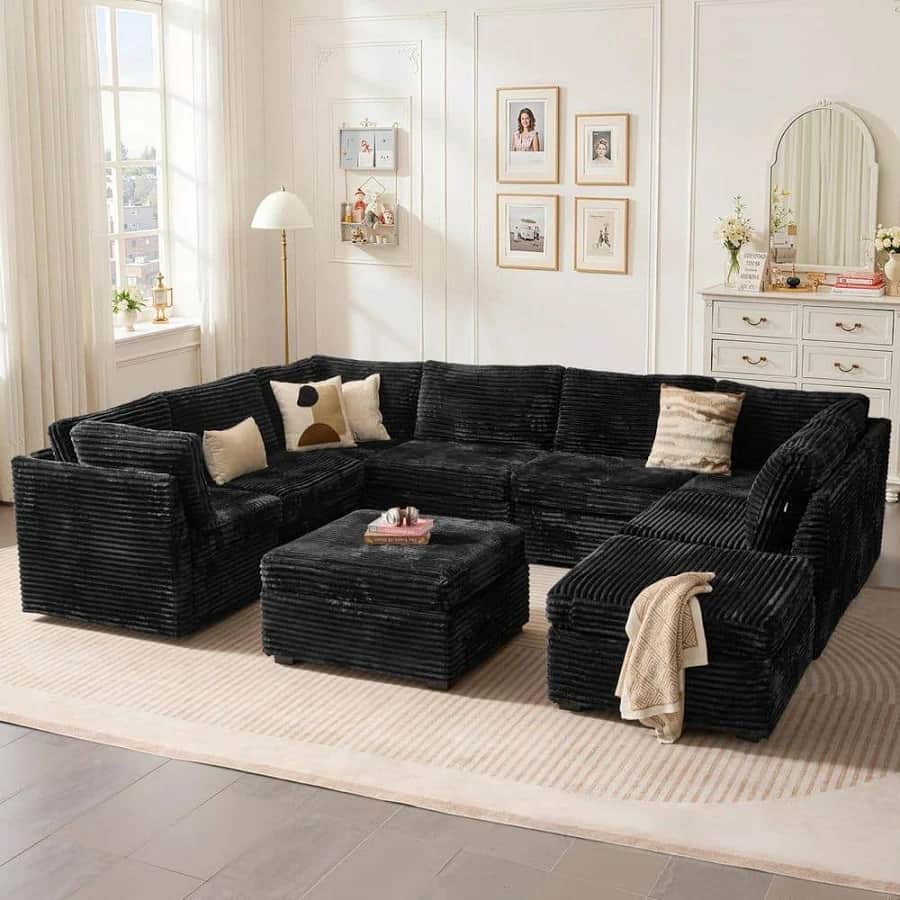 A modular sectional sofa in a deep black color, upholstered in a corduroy-like fabric. The sofa feat… — free FBX 3D model