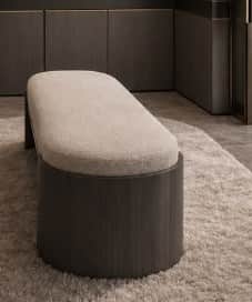 An elongated oval-shaped bench featuring a light-colored upholstered top and a solid, dark wood vene… — 3D model