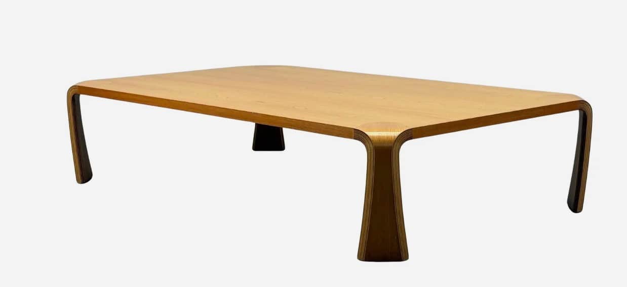 A modern rectangular coffee table constructed from molded plywood with a light wood veneer finish. I… — 3D model