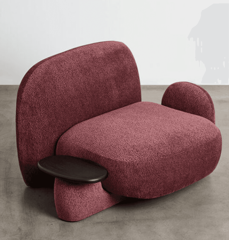 A contemporary armchair with a distinctive, organic silhouette. It features plush, textured upholste… — 3D model