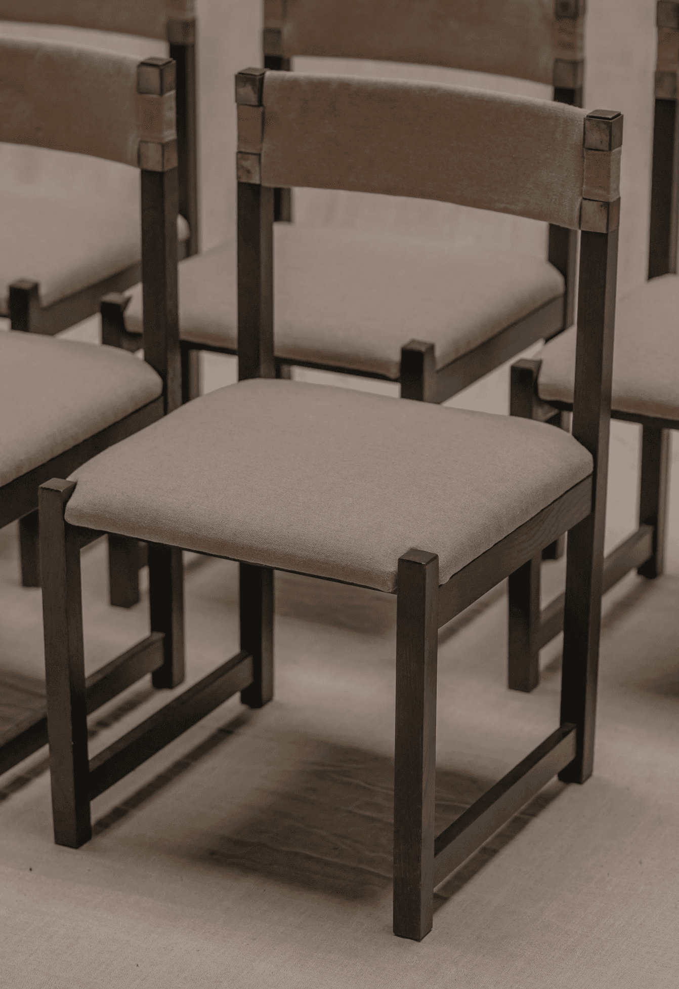 A contemporary chair with a dark metal frame and upholstered seat and back. The frame has a minimali… — 3D model