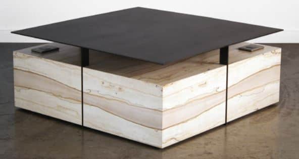 A contemporary coffee table with a distinctive design. It features a thin, square, matte black top t… — free SKP 3D model
