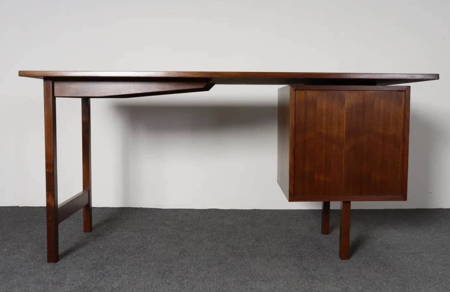 A vintage Mid-Century Modern wooden executive desk featuring a dark brown finish. The desk comprises… — 3D model