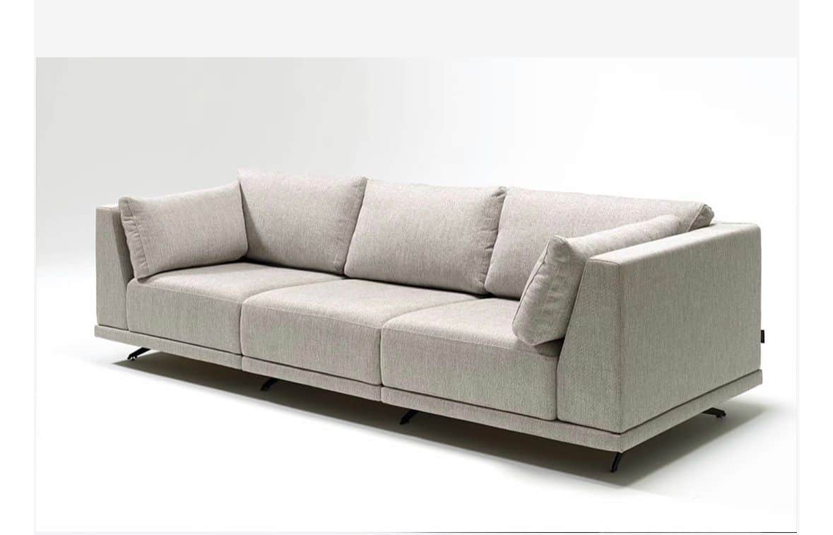 A three-seater modular sofa with a low profile and clean lines. It features plush seat and back cush… — 3D model