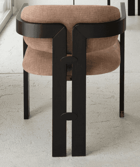 A chair with a distinctive, modern design featuring a robust black frame and a cushioned seat and ba… — 3D model