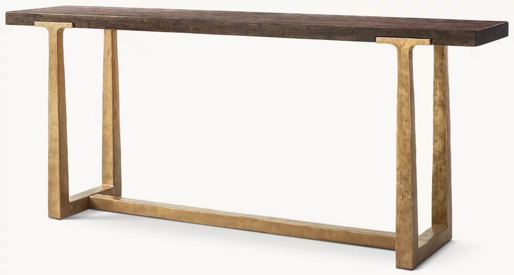 A rectangular console table featuring a rustic dark wood plank top supported by two hammered brass-t… — 3D model