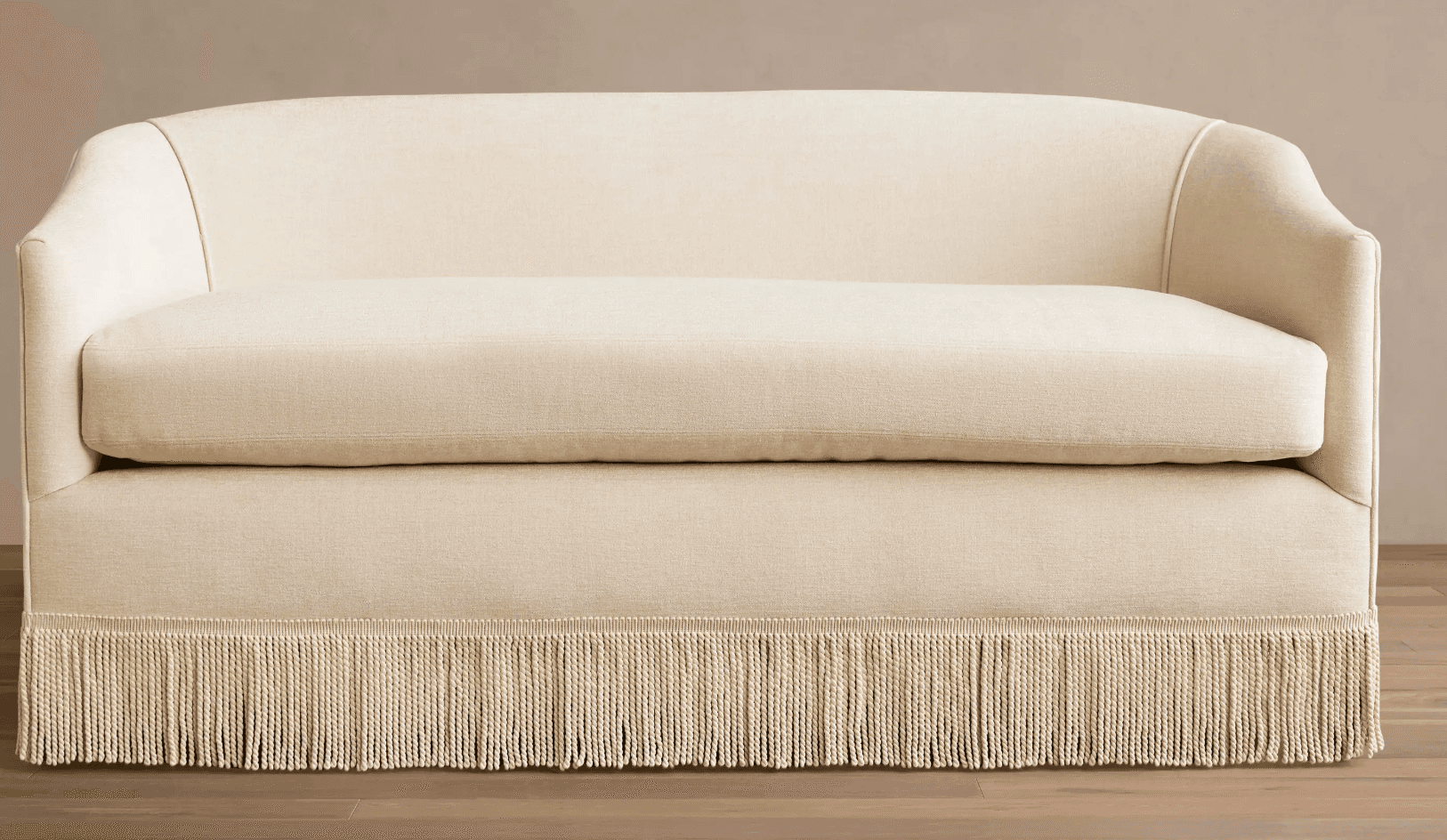 A contemporary loveseat upholstered in a light cream fabric, featuring a curved back, gently rolled… — 3D model
