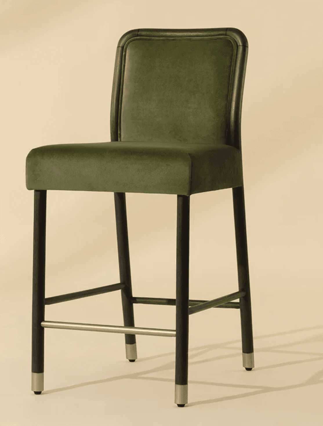 A contemporary bar stool featuring olive green velvet upholstery on both the seat and a rounded back… — 3D model