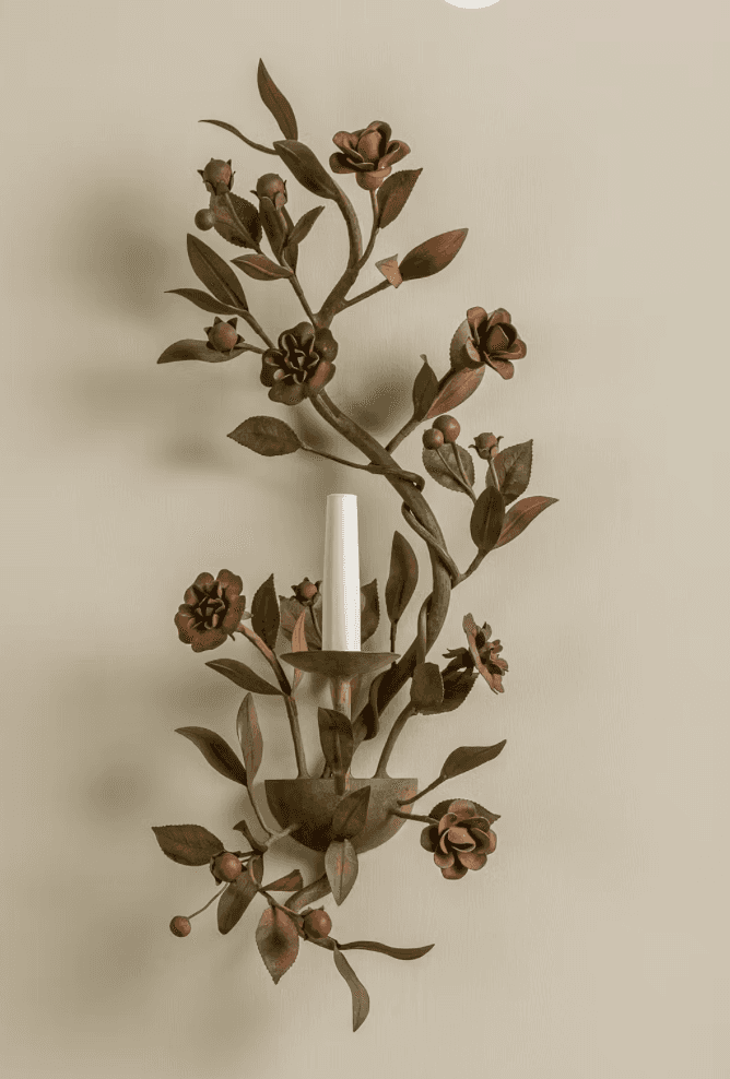A wall-mounted light fixture designed as an intricate botanical arrangement of metallic leaves, flow… — 3D model