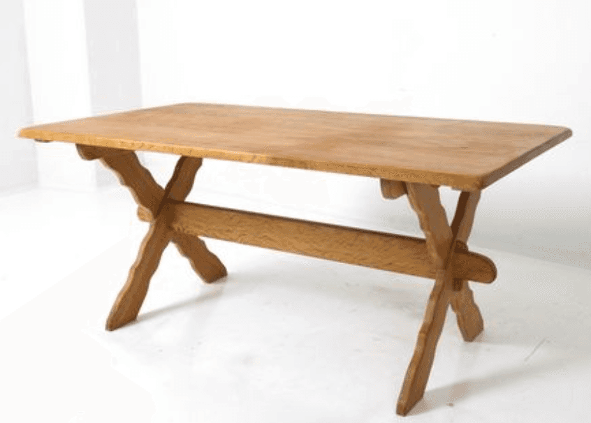A rustic wooden dining table with a rectangular top and an X-shaped leg base. The legs are construct… — free BLEND 3D model