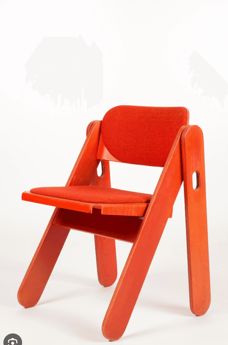 A modern folding chair featuring a vibrant red lacquered plywood frame and matching red fabric uphol… — free GLTF 3D model