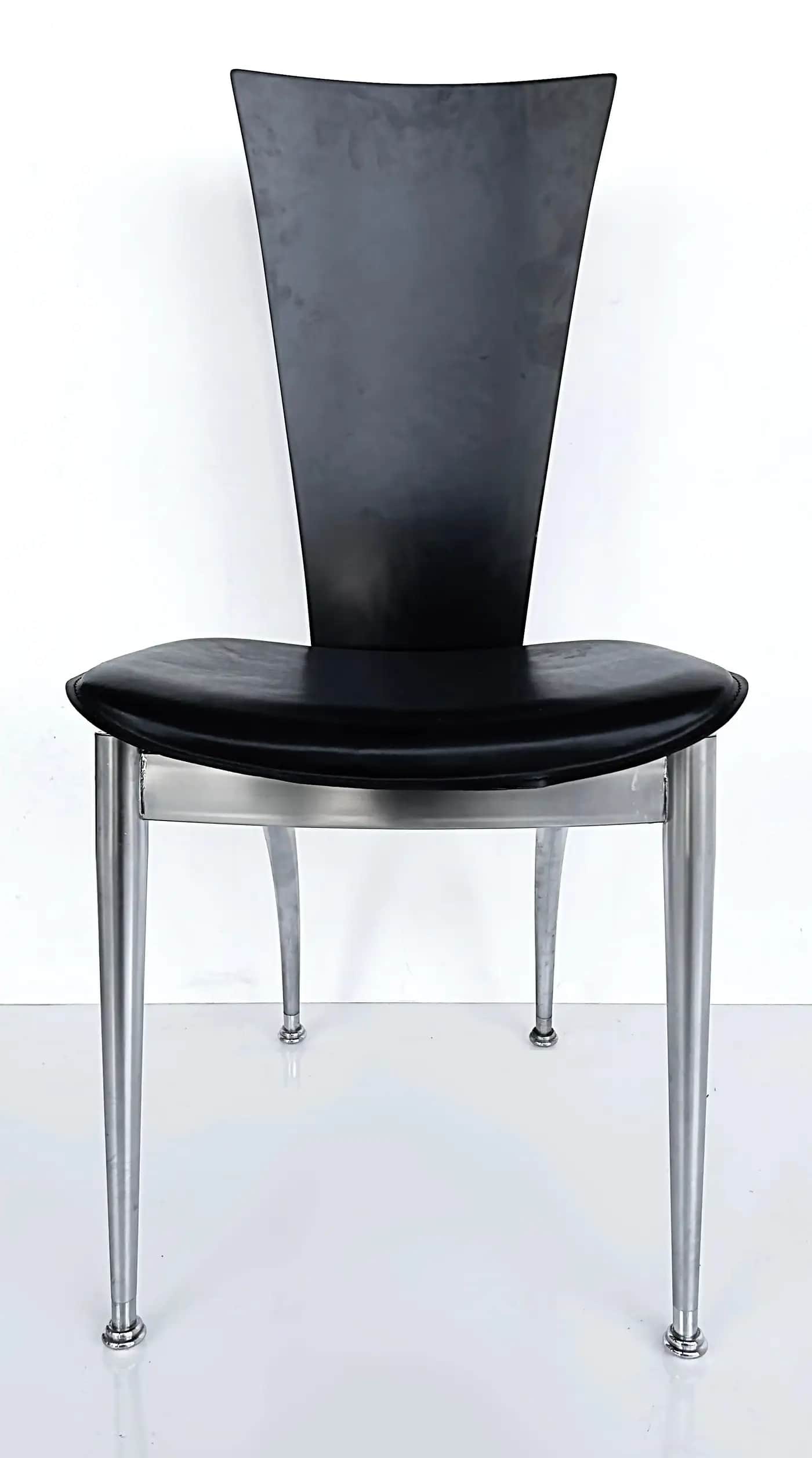 A modern chair featuring a black, curved backrest and a black, cushioned seat. The frame and four ta… — 3D model