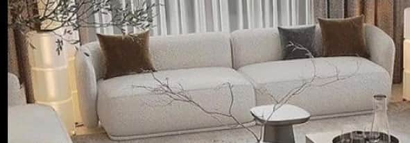 A contemporary modular sectional sofa in a light bouclé fabric, consisting of two low-profile units… — 3D model