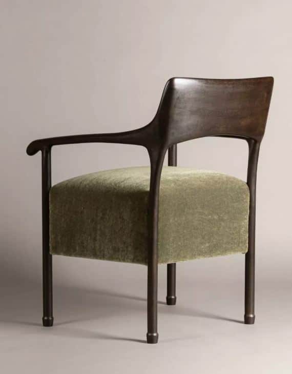 A contemporary lounge chair featuring a dark, sculpted wooden frame and an upholstered seat in olive… — 3D model