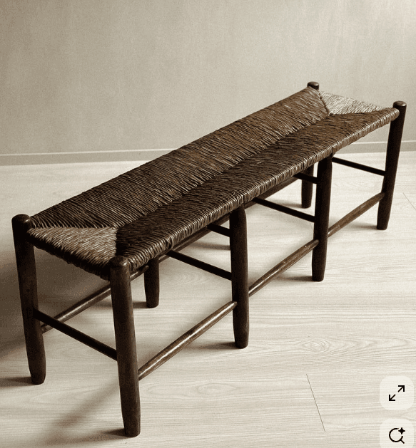 A long, narrow bench with a rush-woven seat. The frame and legs appear to be made of dark wood. The… — free SKP 3D model