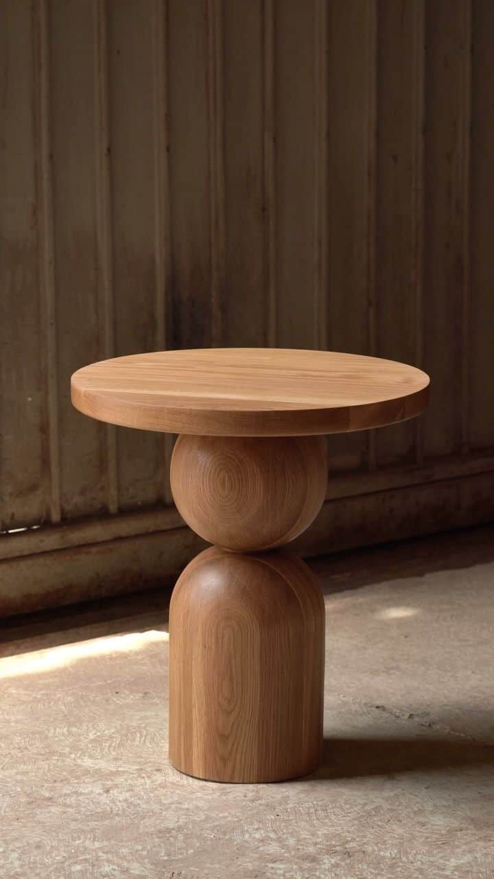 A round-top side table with a unique pedestal base. The base consists of two stacked spherical and a… — 3D model