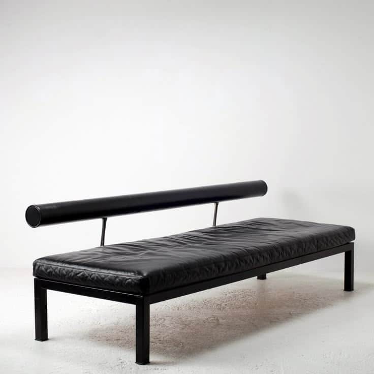 A contemporary bench with a minimalist design. It features a rectangular upholstered seat and a cyli… — 3D model