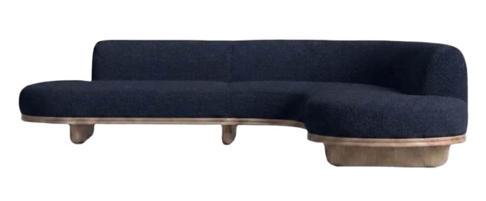 A modern, curved sectional sofa featuring dark blue boucle upholstery and a distinct light wood base… — 3D model