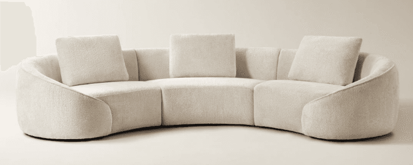 A curved sectional sofa with a textured upholstery and plush throw pillows. The sofa features a low… — 3D model