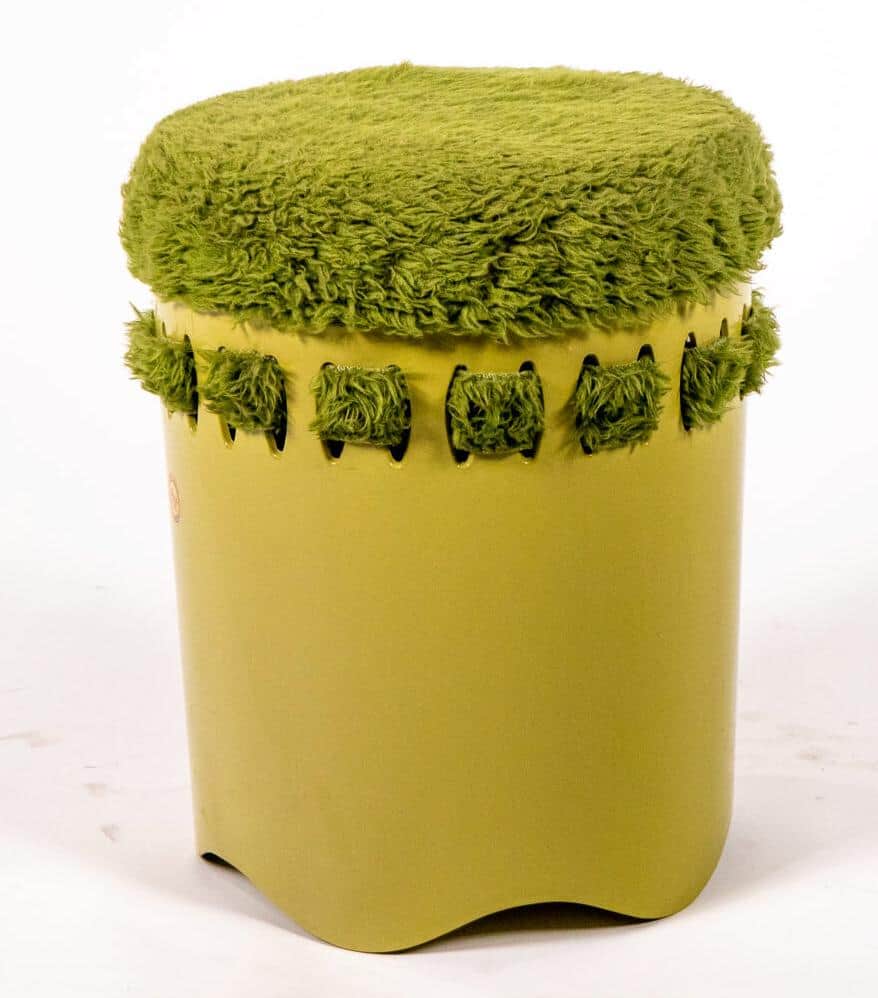 A contemporary cylindrical stool or ottoman featuring a plush, shaggy green upholstered top and a sm… — 3D model