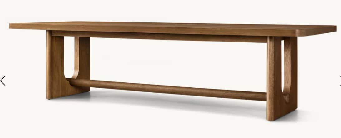 A wooden dining table with a rectangular tabletop and unique U-shaped legs connected by a horizontal… — free OBJ 3D model