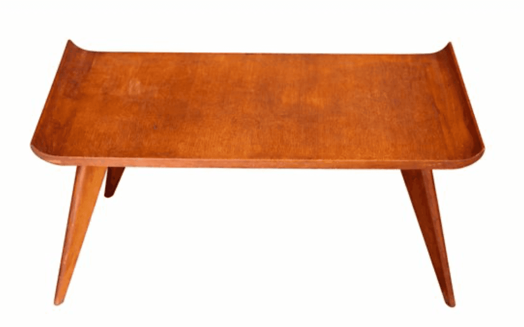 A mid-century modern coffee table with a rectangular, slightly curved wooden top and four tapered le… — 3D model